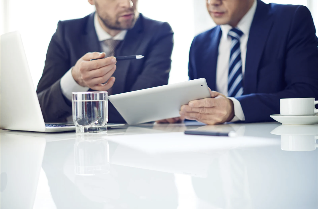 Advisor meeting with client in a private office